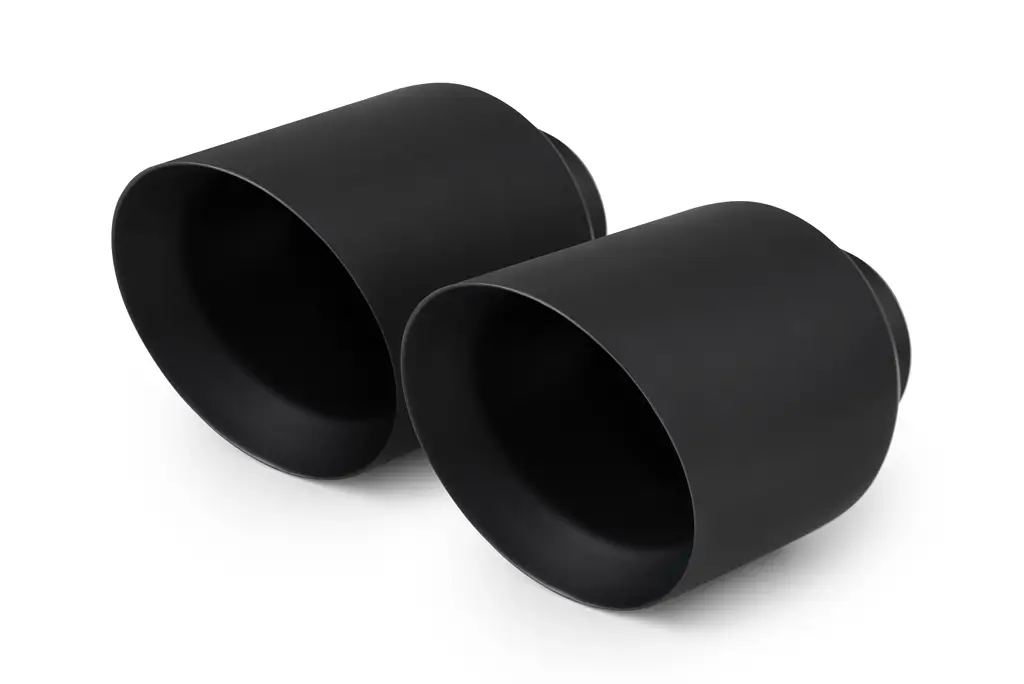 Pair of black dual wall exhaust tips on a white background
